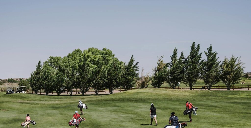 image of people and golfers on a golf course