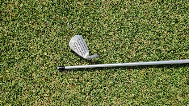 Broken golf club shaft. Broken golf club on the golf course