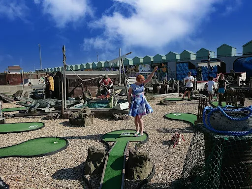 image of a woman in a middle of multiple mini golf courses | Mini Golf Course | Northbridge Golf Club